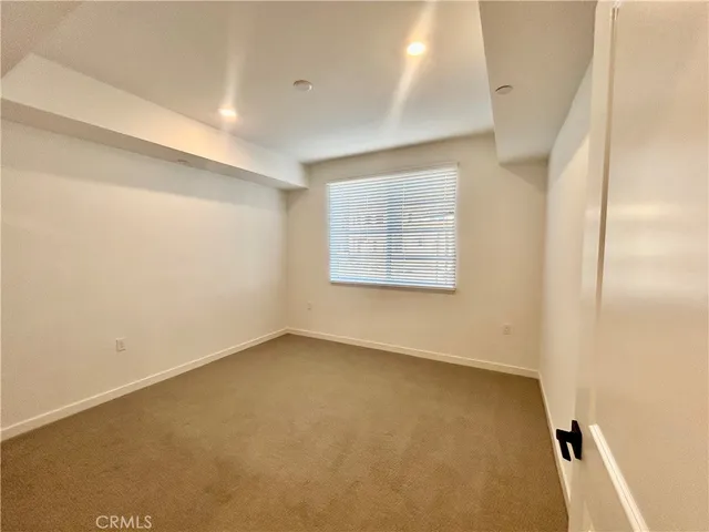 an empty room with a windows