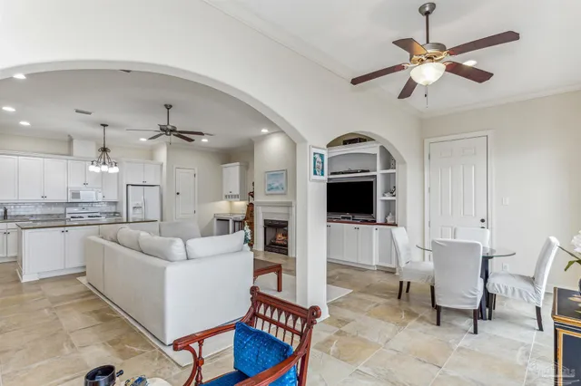 a kitchen with white cabinets and appliances