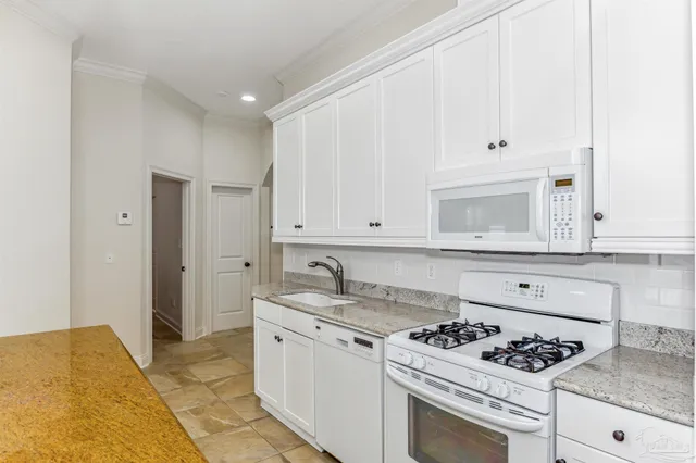 a bathroom with a toilet sink and shower