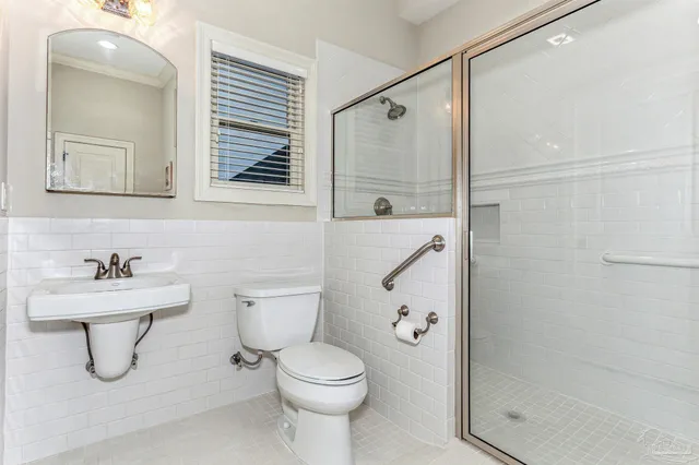a kitchen with granite countertop white cabinets and stainless steel appliances