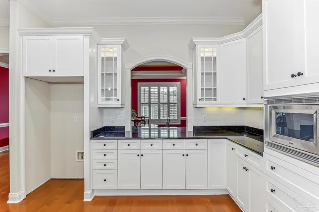 a bedroom with a large bed and a large window
