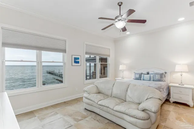 a roof deck with table and chairs