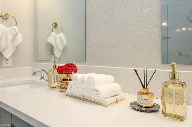 a bathroom with a tub sink and curtain