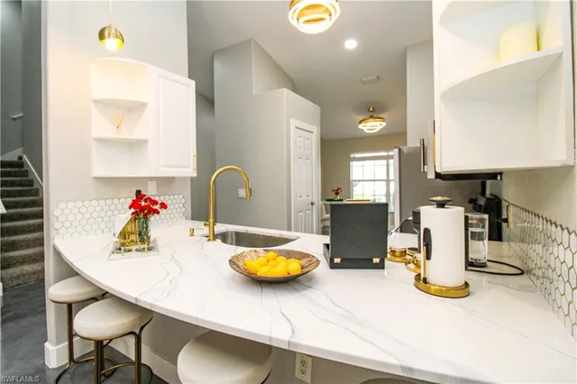 a kitchen with a sink and a stove