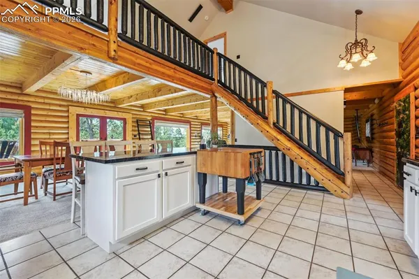 a view of entryway dining room and hall with wooden floor