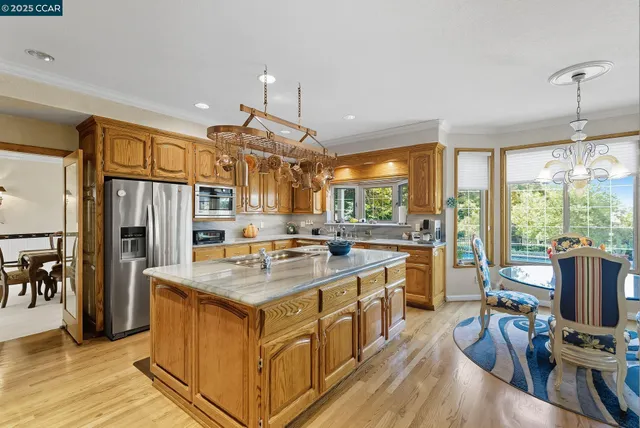 a kitchen that has a lot of cabinets in it