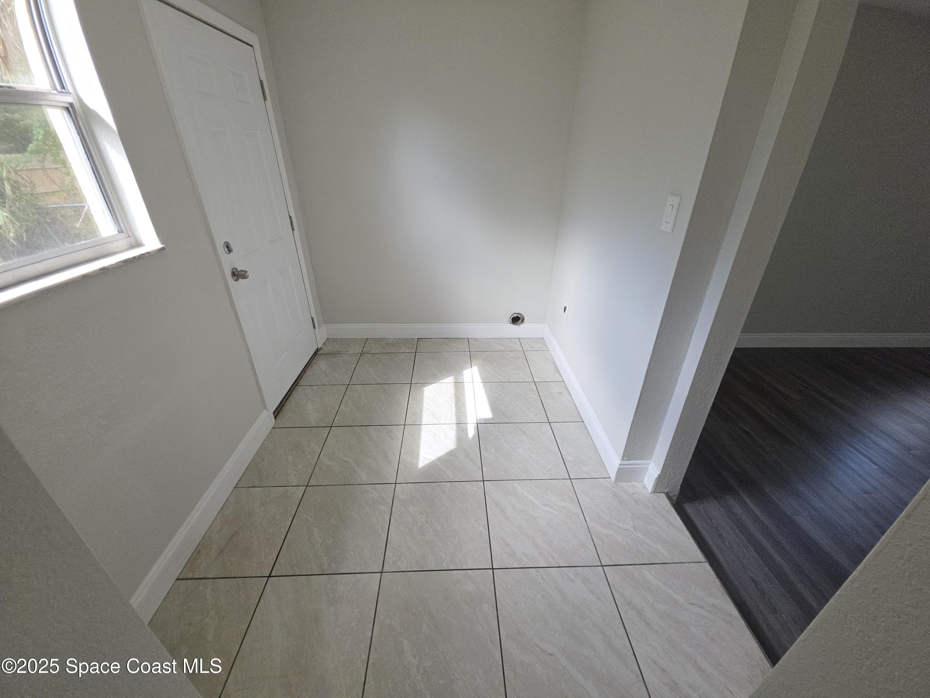 413 Dove Avenue Rockledge, FL 32955 - Photo 5 of 10 a view of an empty room and a window