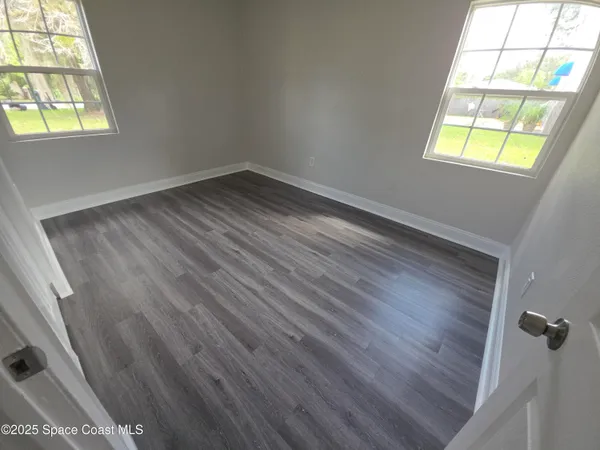 an empty room with windows