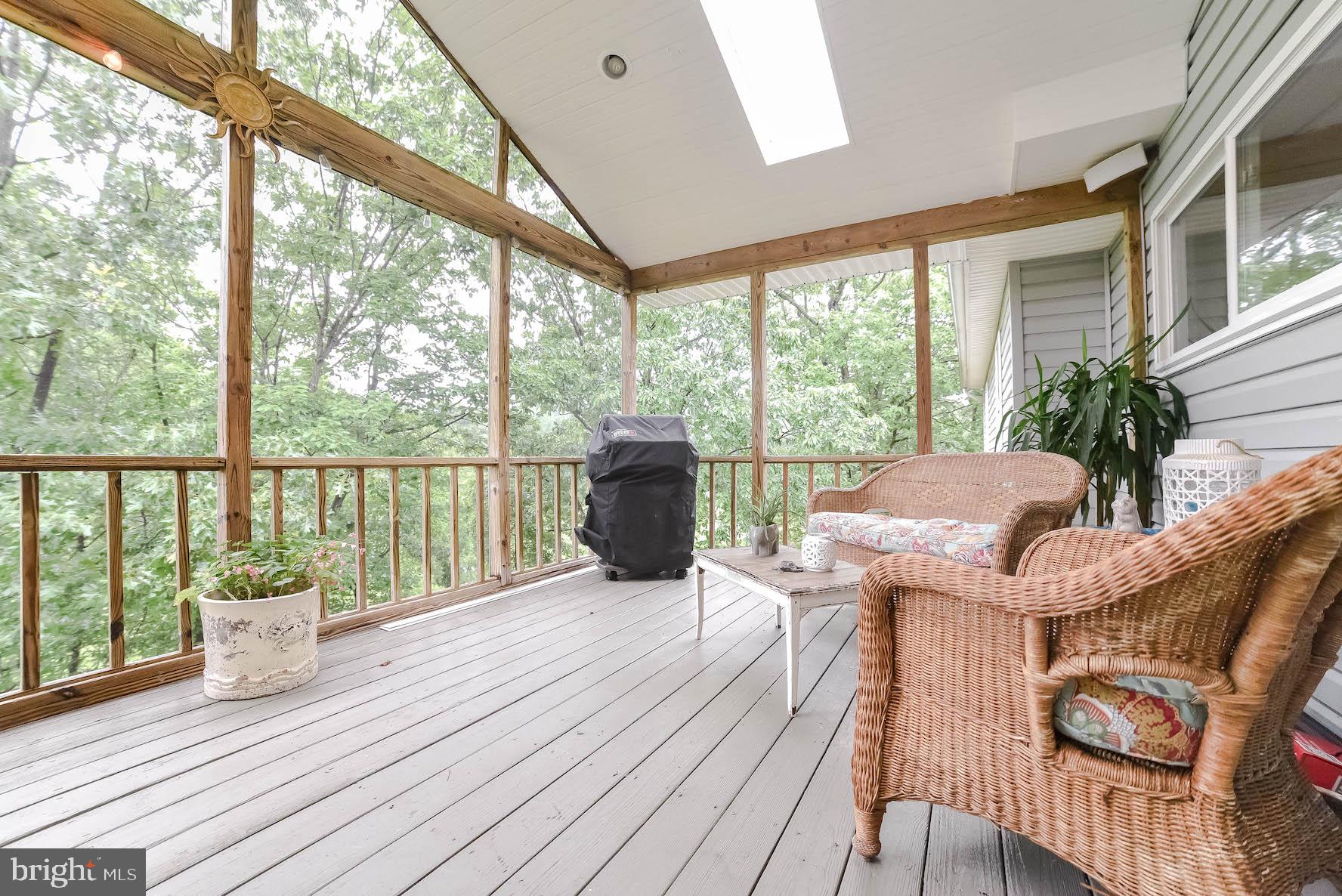 11131 Rawhide Road Lusby, MD 20657 - Photo 14 of 56 Large Screened in Deck - Overlooking Golf Course