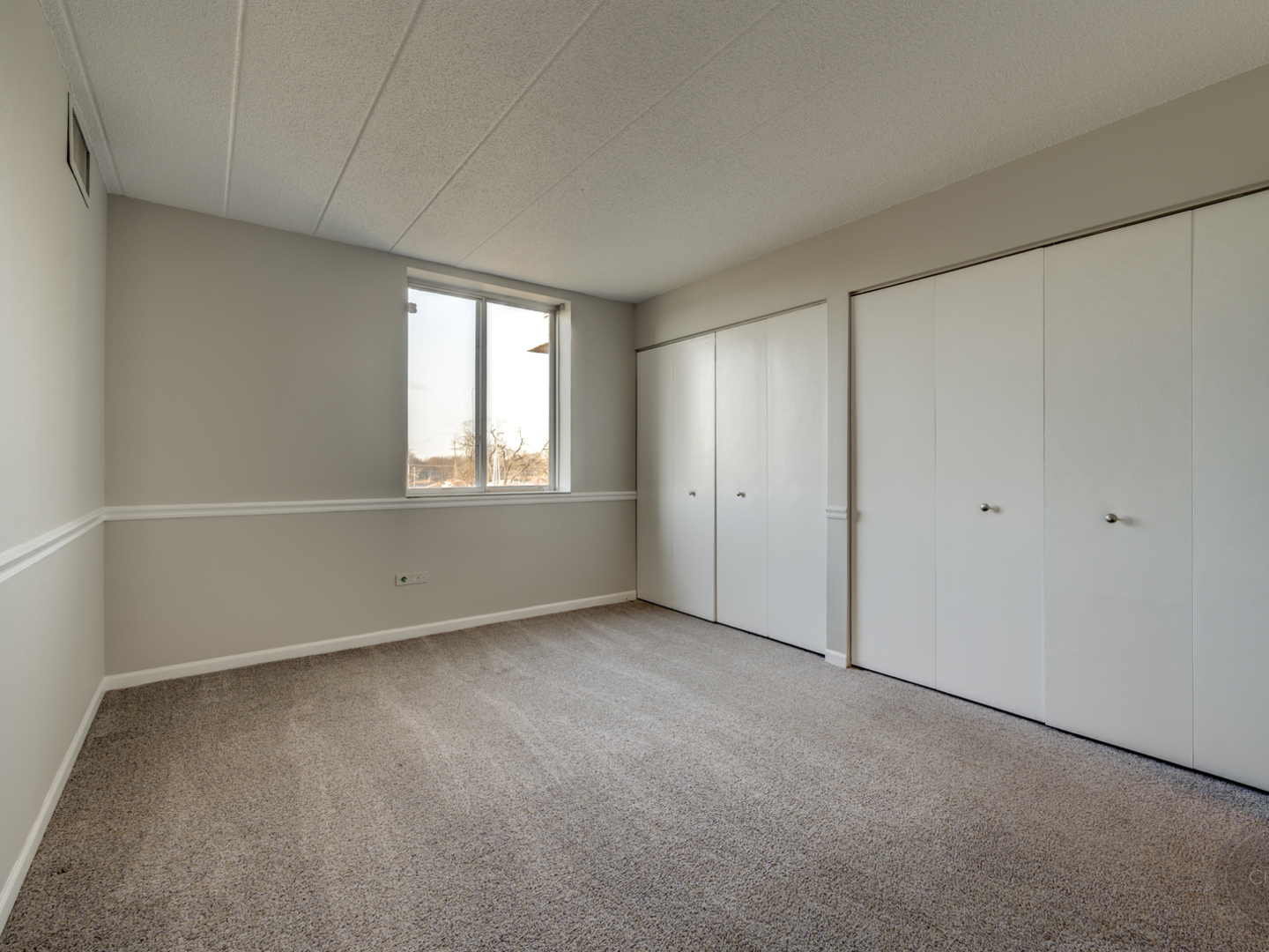 100 West Butterfield Road, Unit 405N Elmhurst, IL 60126 - Photo 13 of 27 an empty room with windows
