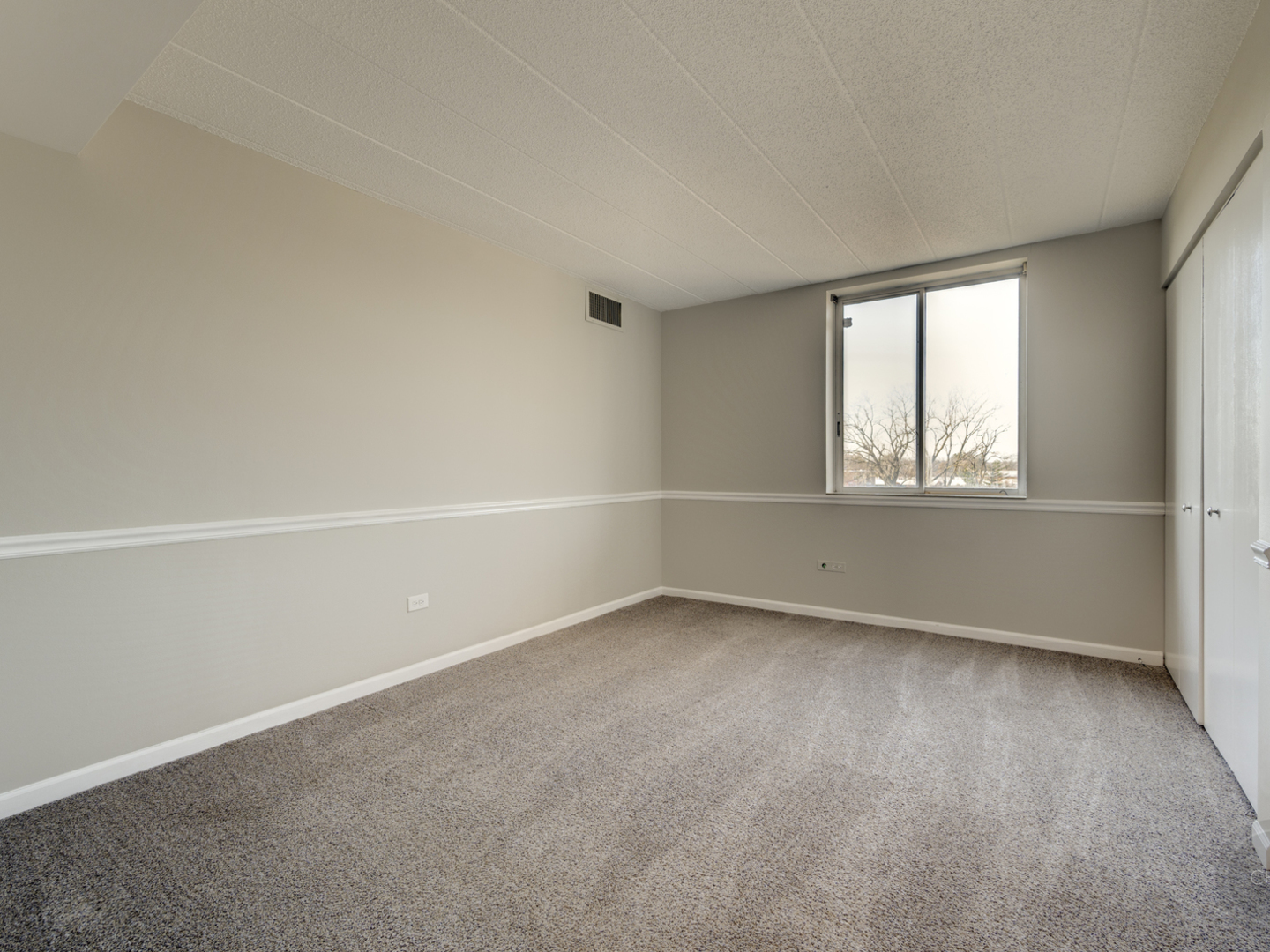 100 West Butterfield Road, Unit 405N Elmhurst, IL 60126 - Photo 15 of 27 an empty room with a window