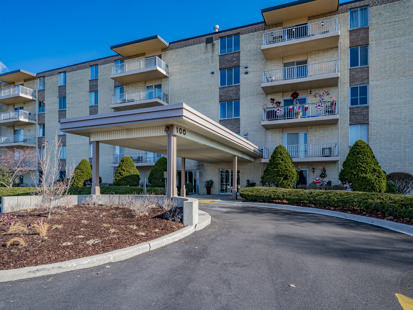 100 West Butterfield Road, Unit 405N Elmhurst, IL 60126 - Photo 2 of 27 front view of a building with a garden
