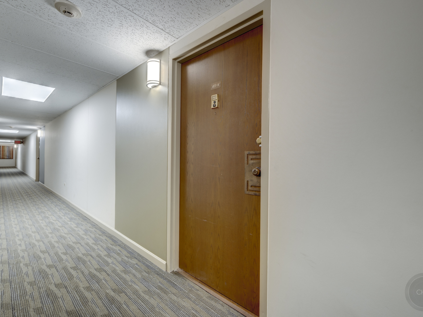 100 West Butterfield Road, Unit 405N Elmhurst, IL 60126 - Photo 5 of 27 a view of a hallway with wooden floor