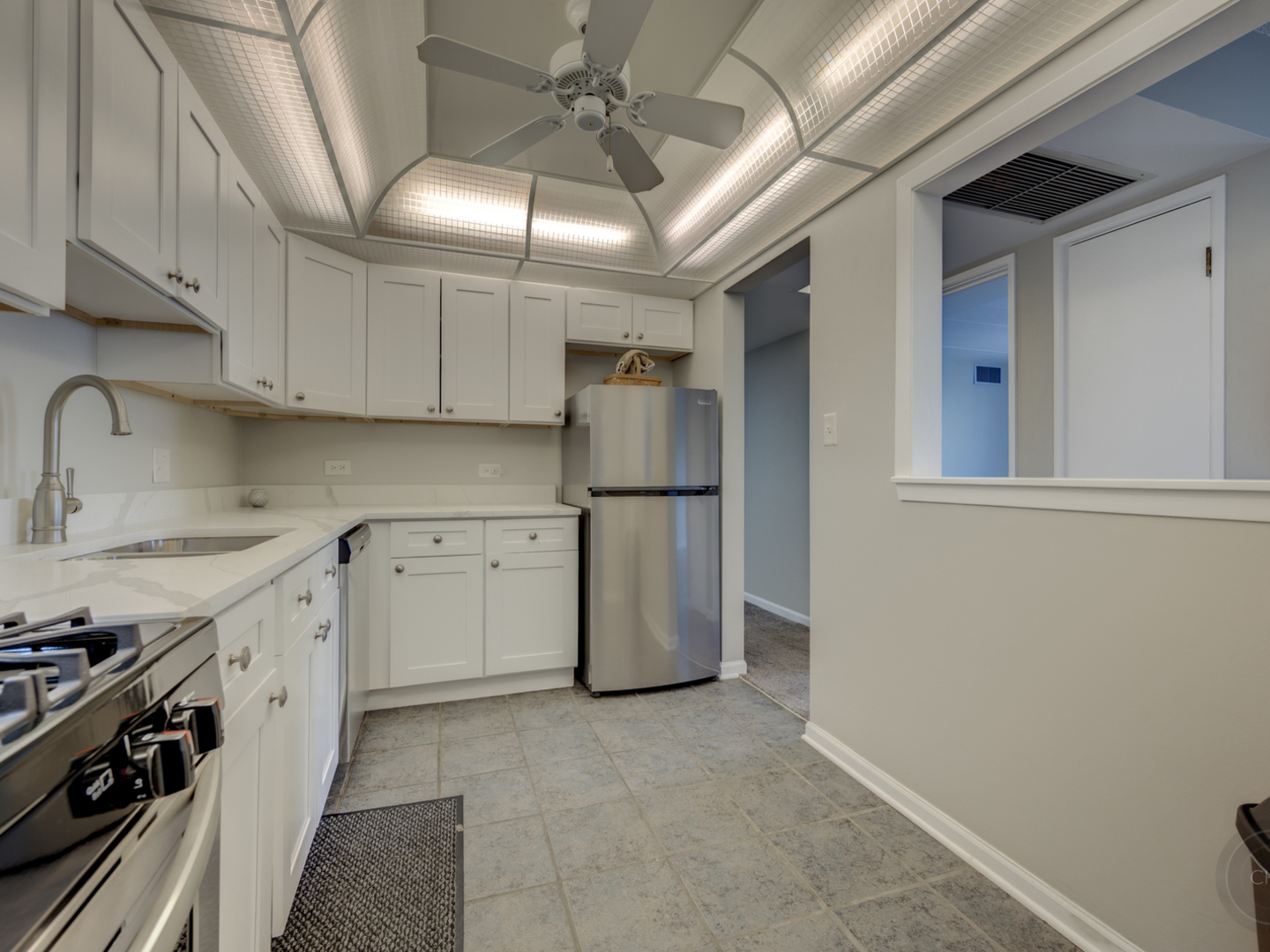 100 West Butterfield Road, Unit 405N Elmhurst, IL 60126 - Photo 9 of 27 a kitchen with refrigerator and cabinets