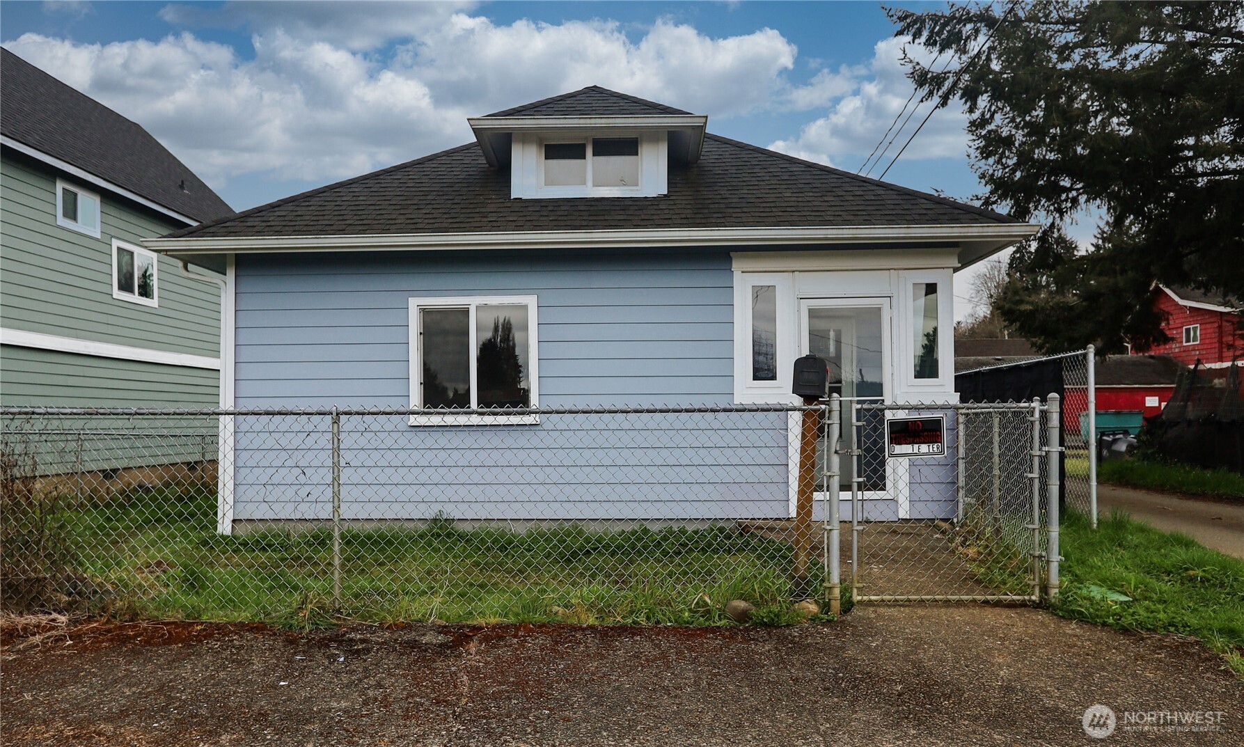 912 Ramer Avenue Hoquiam, WA 98550 - Photo 2 of 20 a front view of a house with a yard
