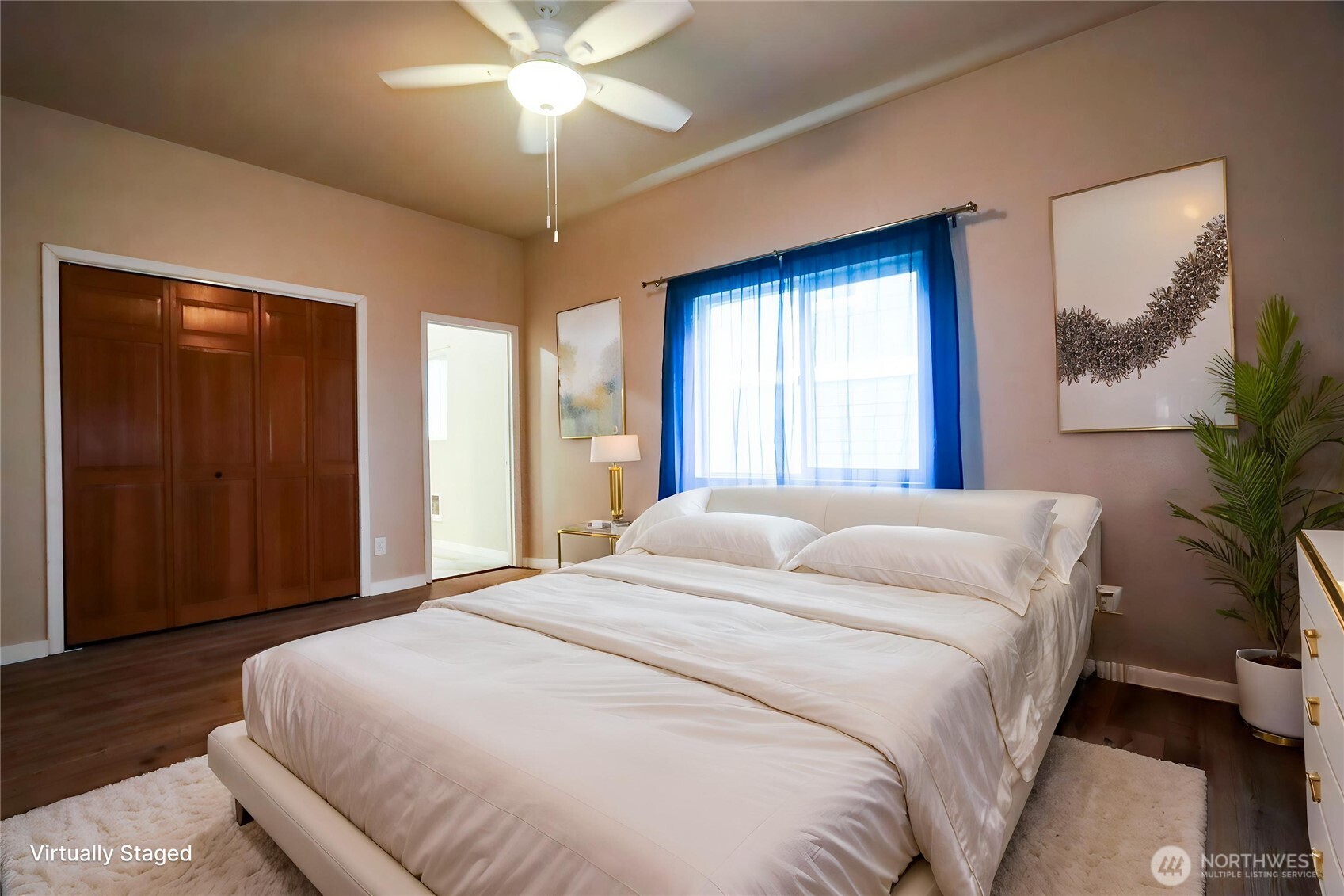 912 Ramer Avenue Hoquiam, WA 98550 - Photo 9 of 20 a bedroom with a large bed and a chandelier