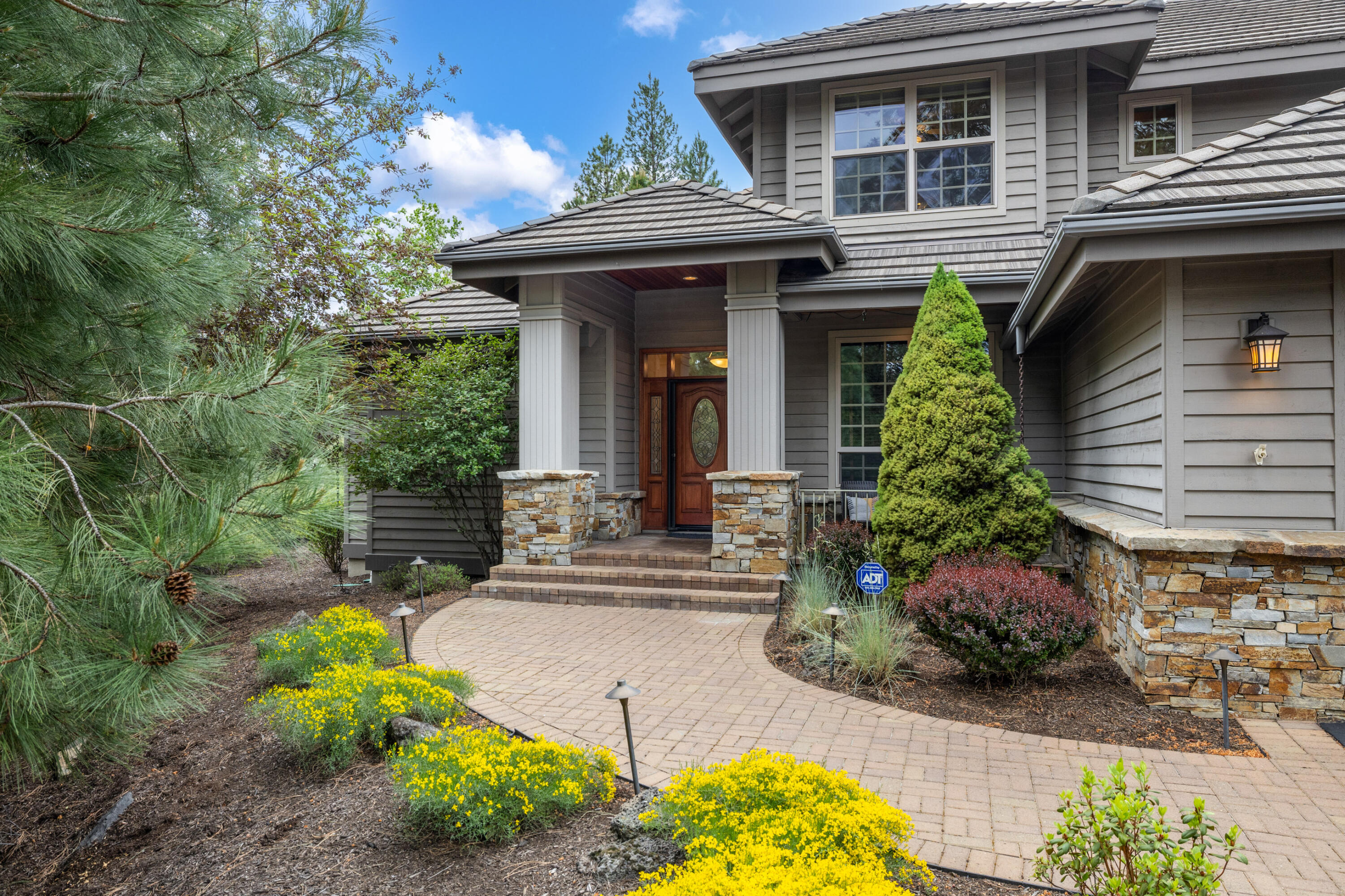 19598 Green Lakes Loop Bend, OR 97702 - Photo 4 of 89 a front view of a house with garden