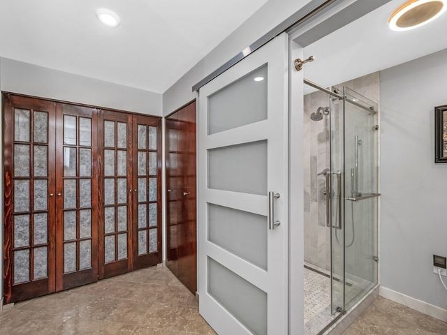 a bathroom with a shower and a tub