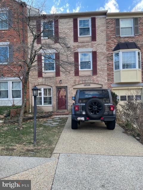 10920 Pebble Run Drive Silver Spring, MD 20902 - Photo 1 of 1 a car parked in front of a brick building