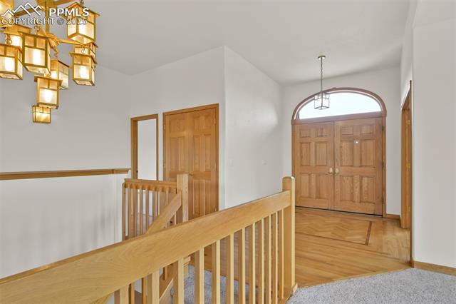 6240 Wilson Road Colorado Springs, CO 80919 - Photo 4 of 42 View of the entry and foyer. Guest suite is to the left, Office/Den area is to the right.
