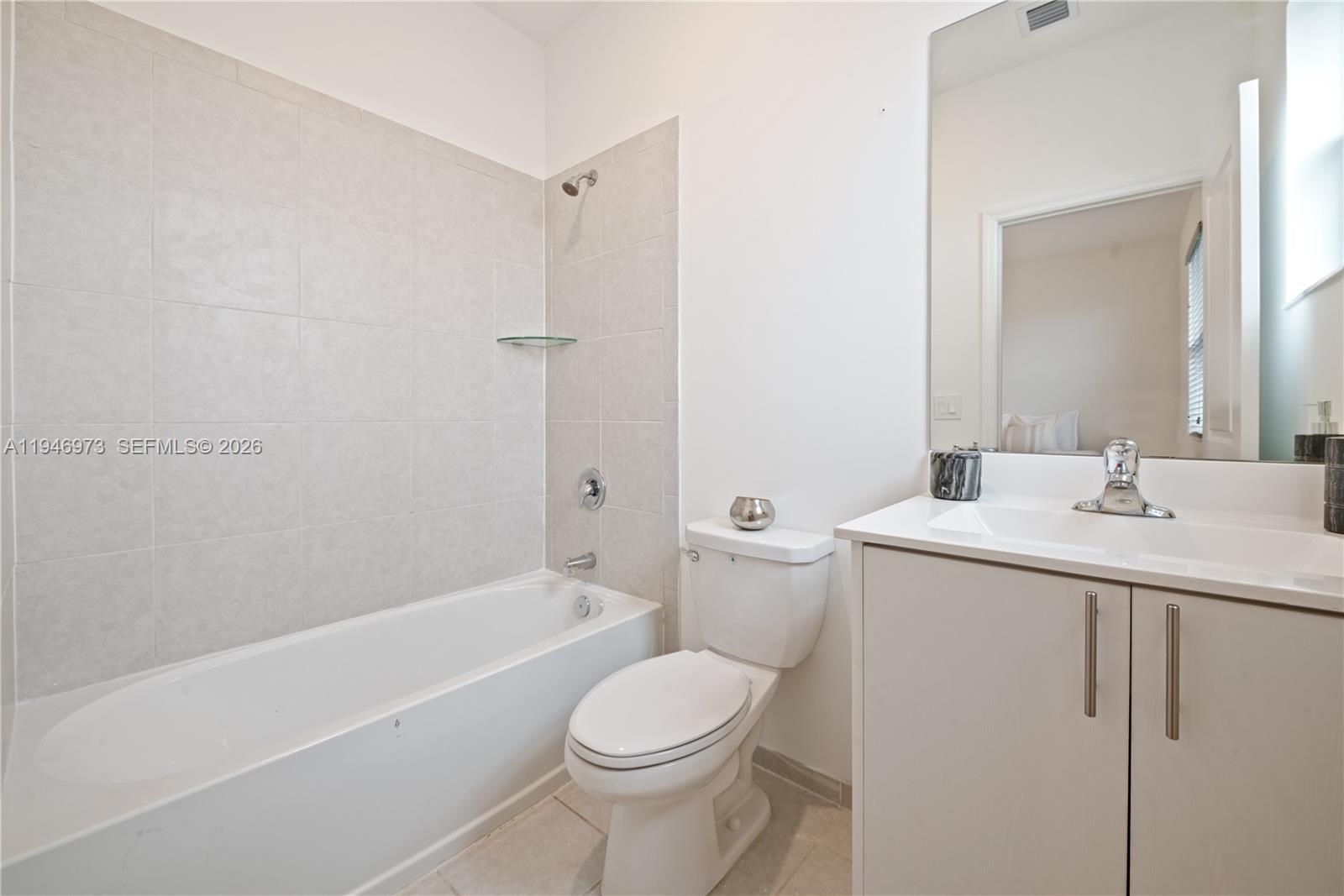 13236 Southwest 286th Street Homestead, FL 33033 - Photo 14 of 23 a bathroom with a sink toilet and shower