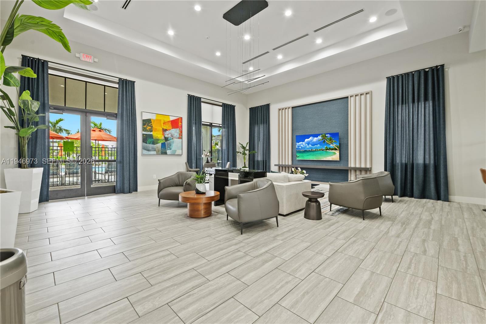 13236 Southwest 286th Street Homestead, FL 33033 - Photo 19 of 23 a lobby with furniture and flat screen tv