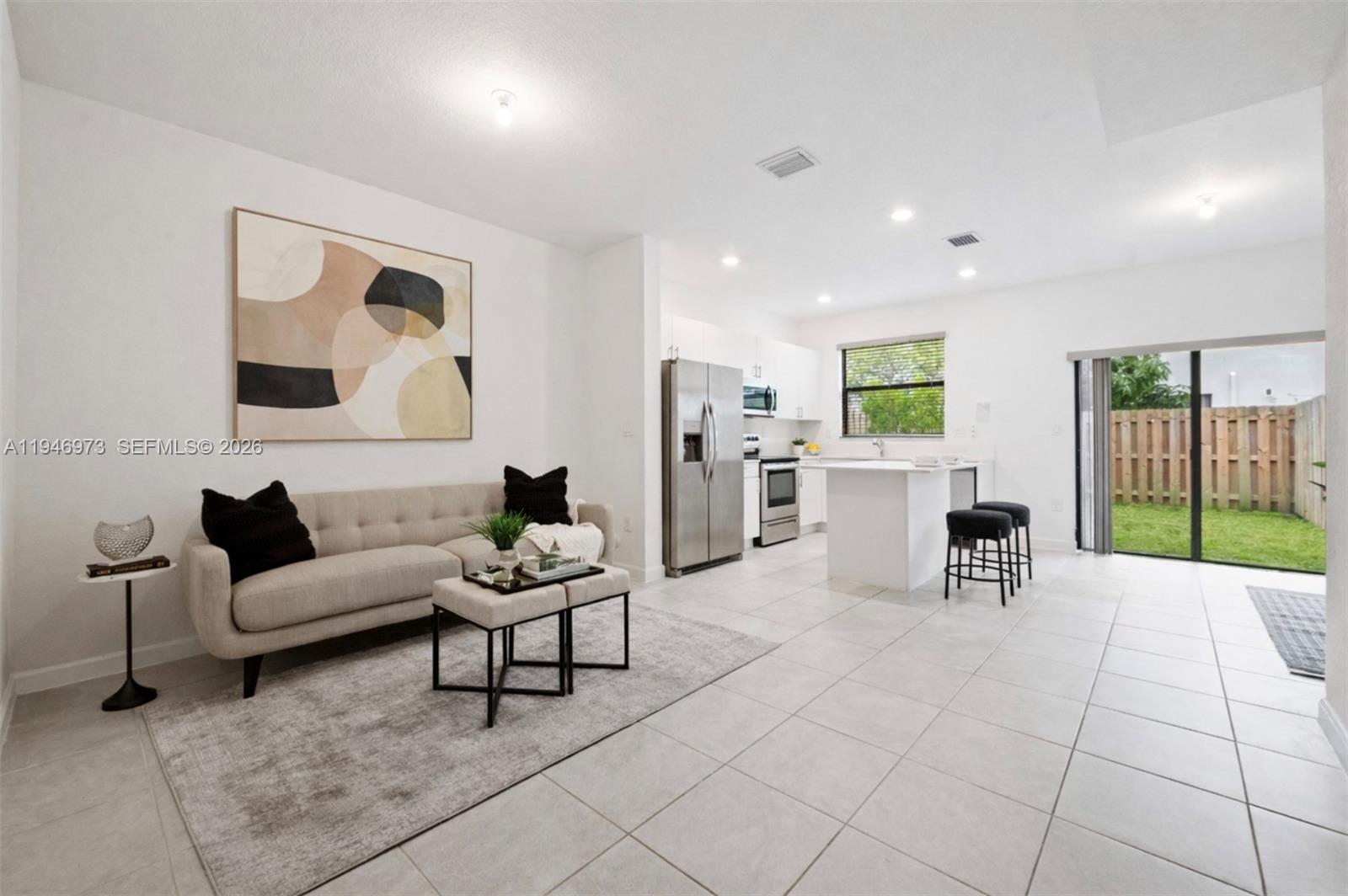 13236 Southwest 286th Street Homestead, FL 33033 - Photo 5 of 23 a living room with furniture and kitchen view