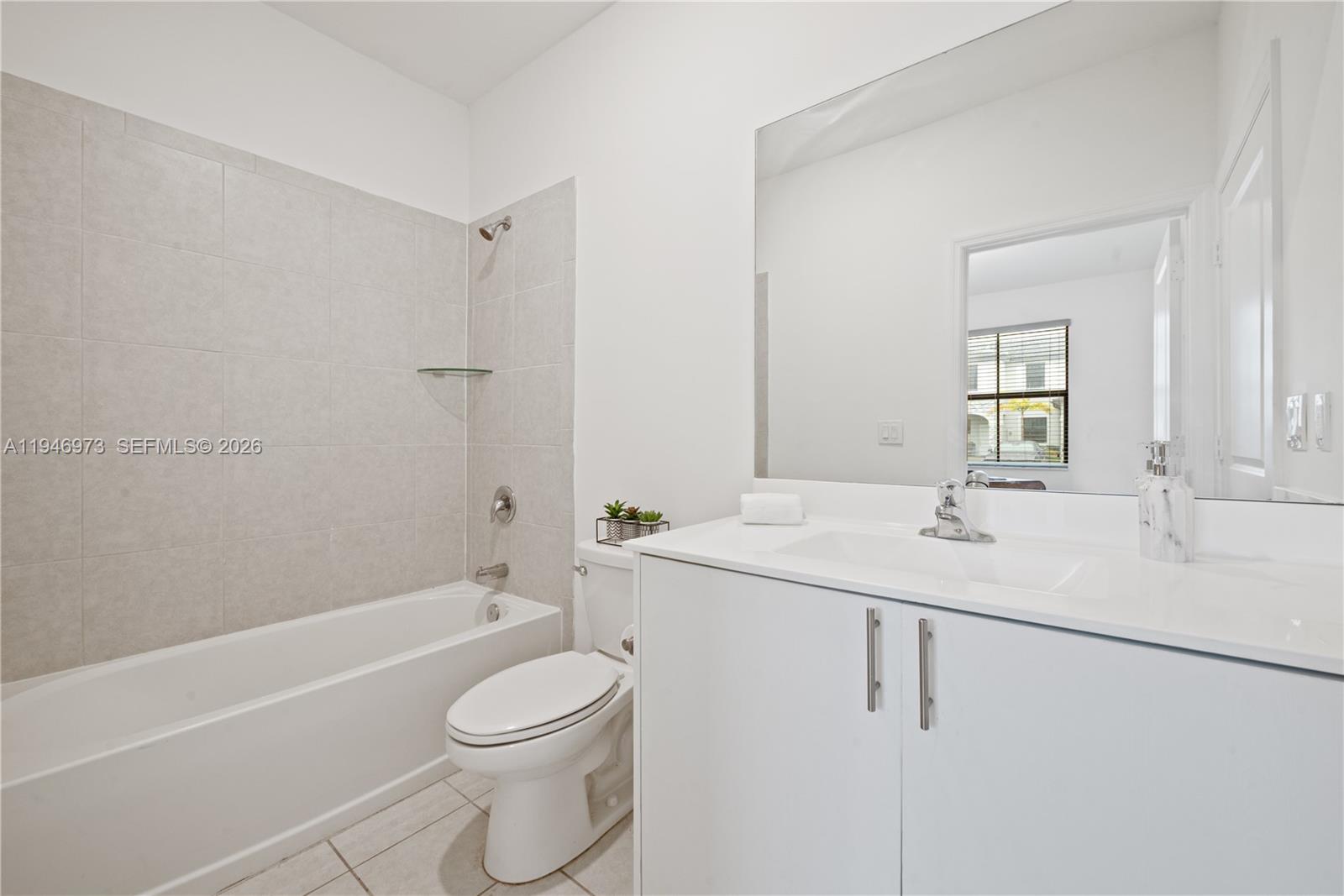 13236 Southwest 286th Street Homestead, FL 33033 - Photo 9 of 23 a bathroom with a sink a toilet and a bathtub