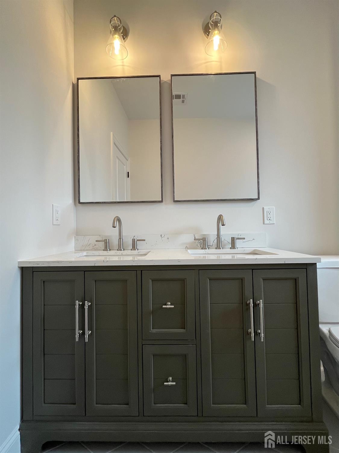 10 Johnson Avenue Matawan, NJ 07747 - Photo 13 of 26 a bathroom with a sink vanity and mirror