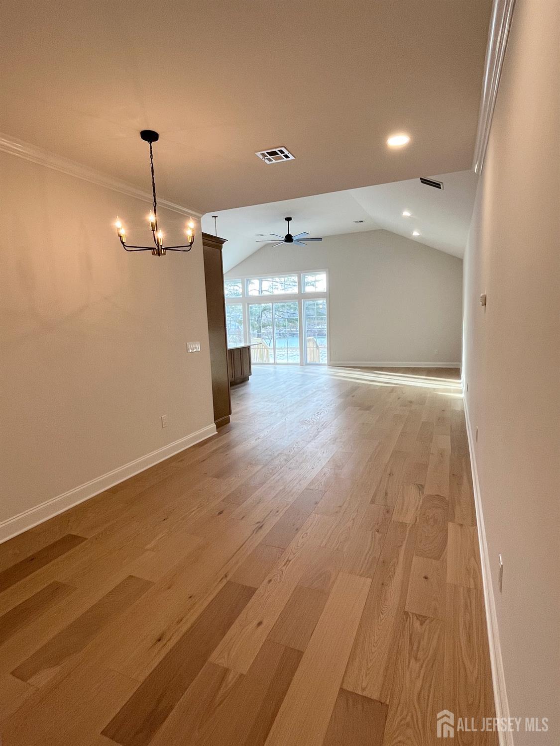 10 Johnson Avenue Matawan, NJ 07747 - Photo 18 of 26 wooden floor in an empty room with a window