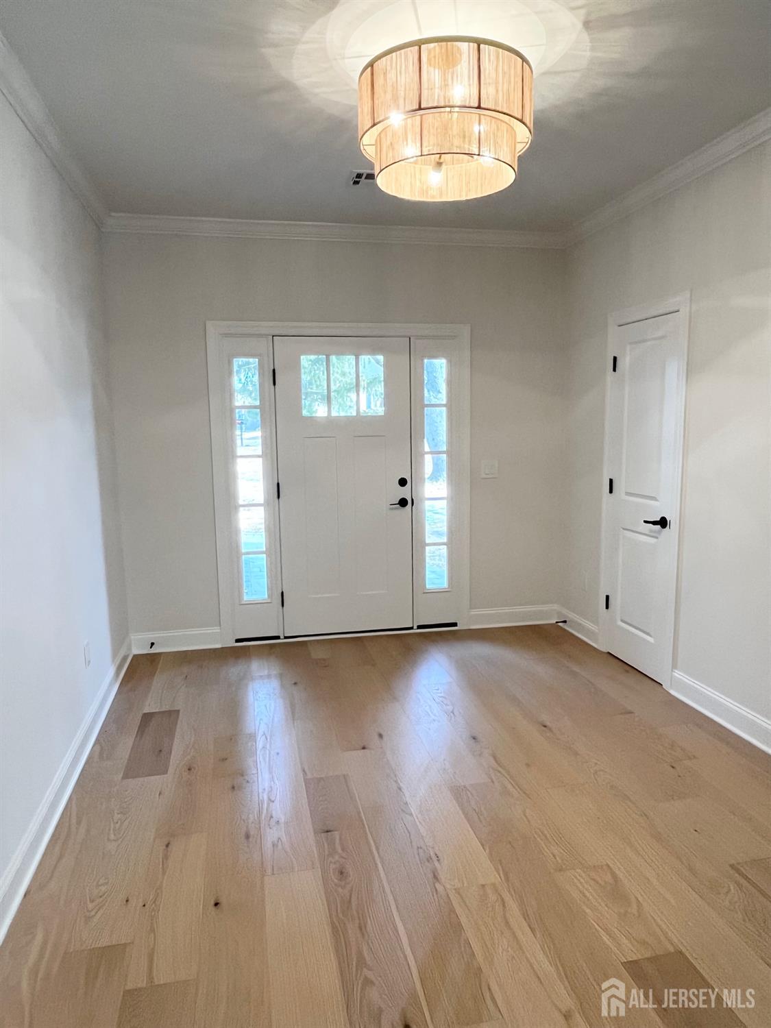 10 Johnson Avenue Matawan, NJ 07747 - Photo 19 of 26 an empty room with wooden floor and windows