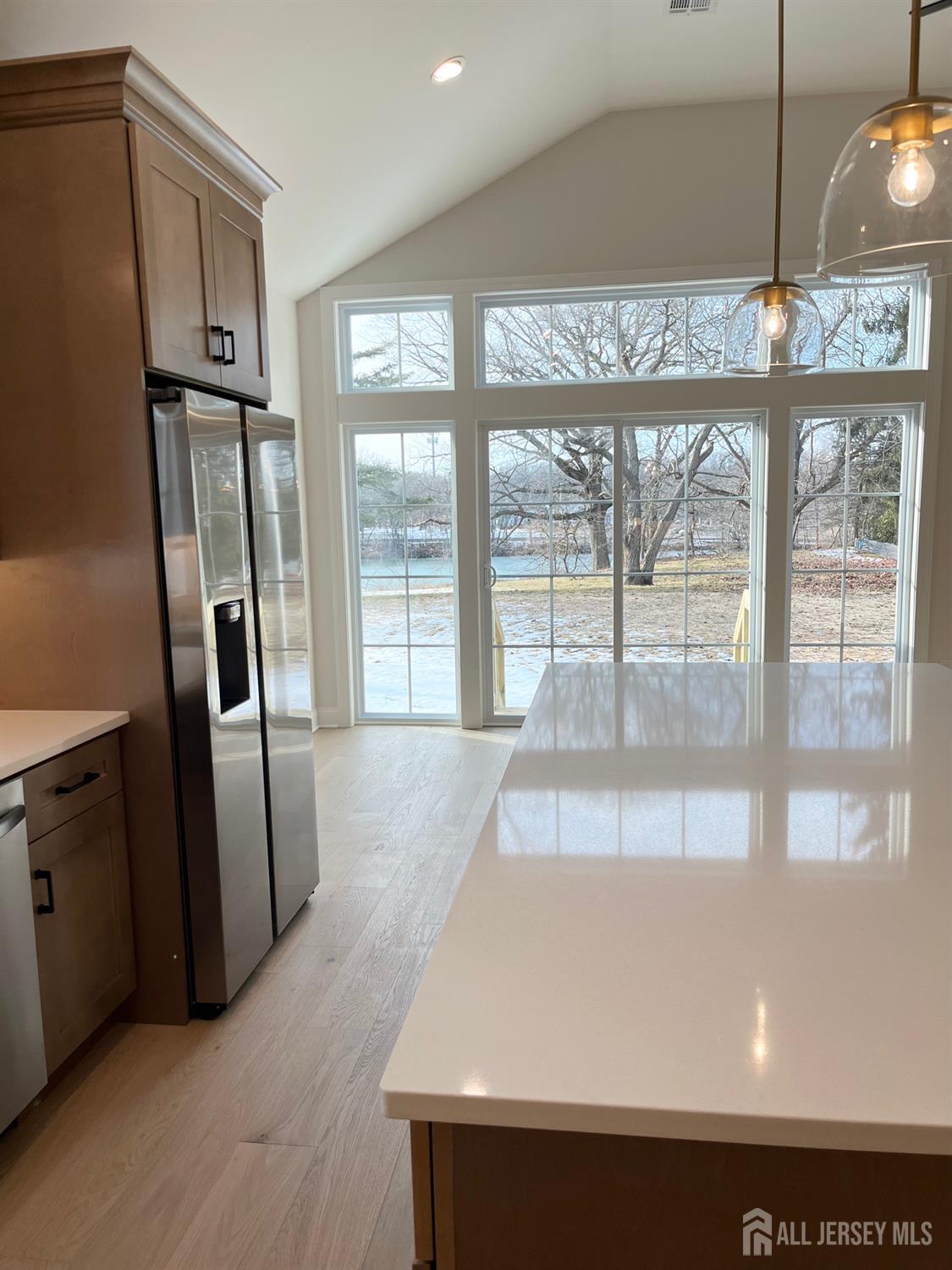 10 Johnson Avenue Matawan, NJ 07747 - Photo 5 of 26 a view of a refrigerator in kitchen and wooden floor