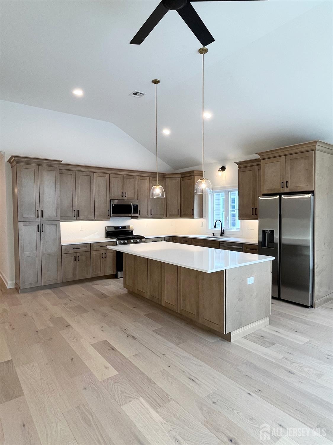 10 Johnson Avenue Matawan, NJ 07747 - Photo 6 of 26 a large kitchen with a center island and stainless steel appliances