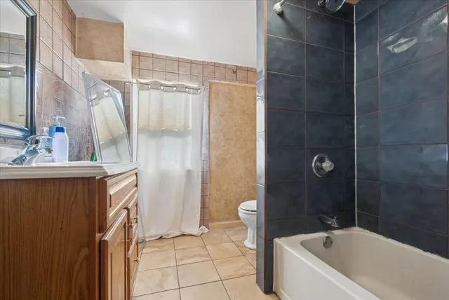 a bathroom with a bathtub and a sink