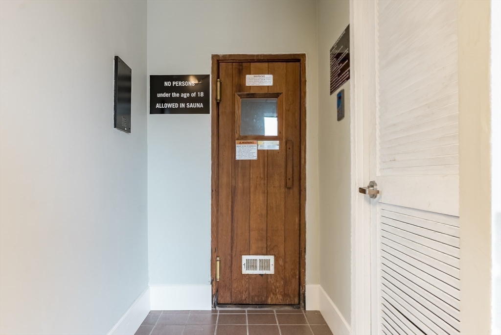 45 Main Street, Unit 112 Wareham, MA 02571 - Photo 24 of 30 a view of a hallway with wooden floor and entryway