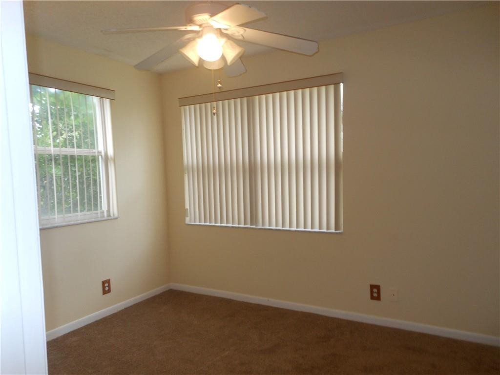599 Racquet Club Road, Unit 65 Weston, FL 33326 - Photo 17 of 18 an empty room with a window