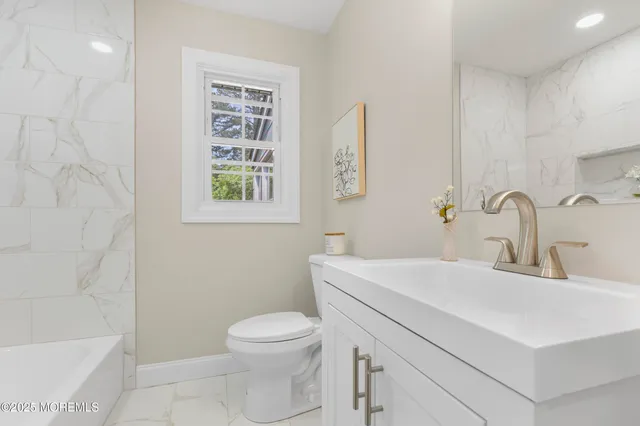 a bathroom with a shower and a bathtub