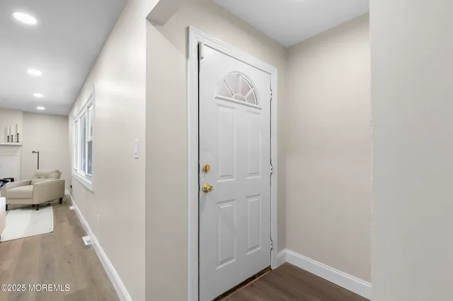 a very nice looking room with wooden floor