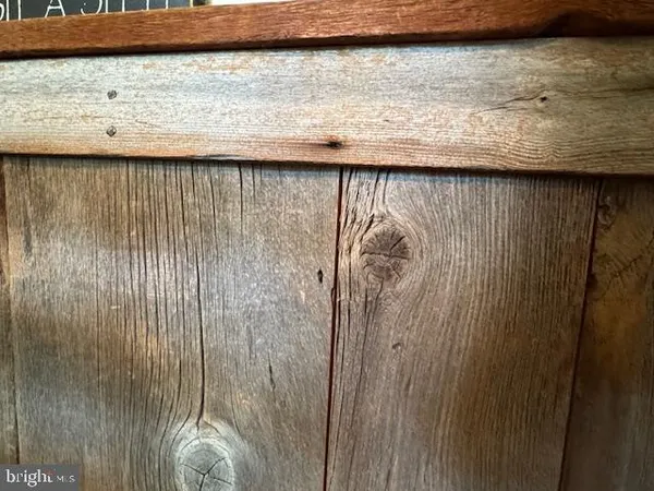 a kitchen with sink refrigerator and dining table