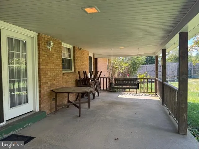 a room with furniture and a wooden floor