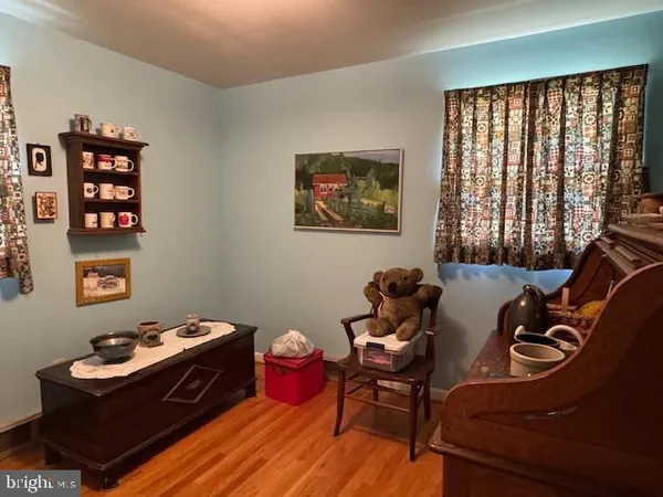 a bedroom with a large bed and a dresser