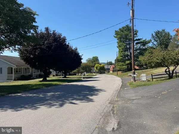 a view of a house with a street