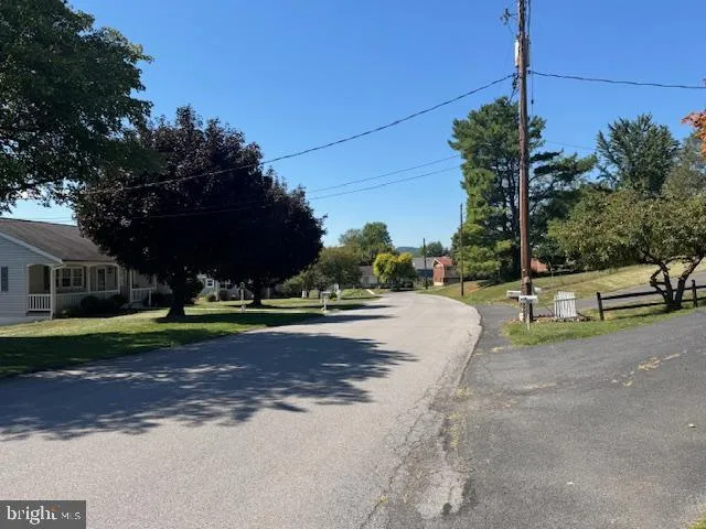 a view of a house with a street