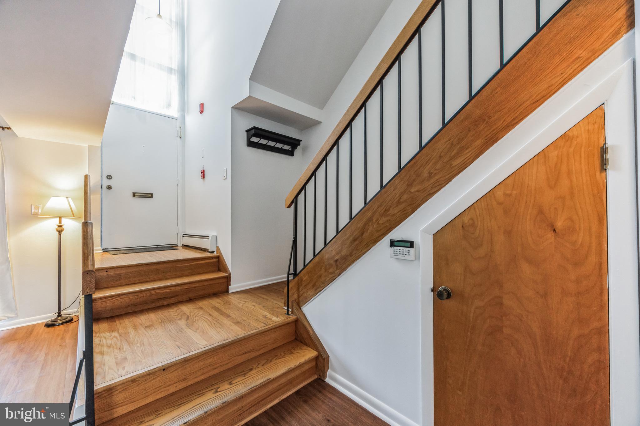 1928 Rodman Street, Unit A Philadelphia, PA 19146 - Photo 15 of 28 a view of staircase with lots of frames on wall