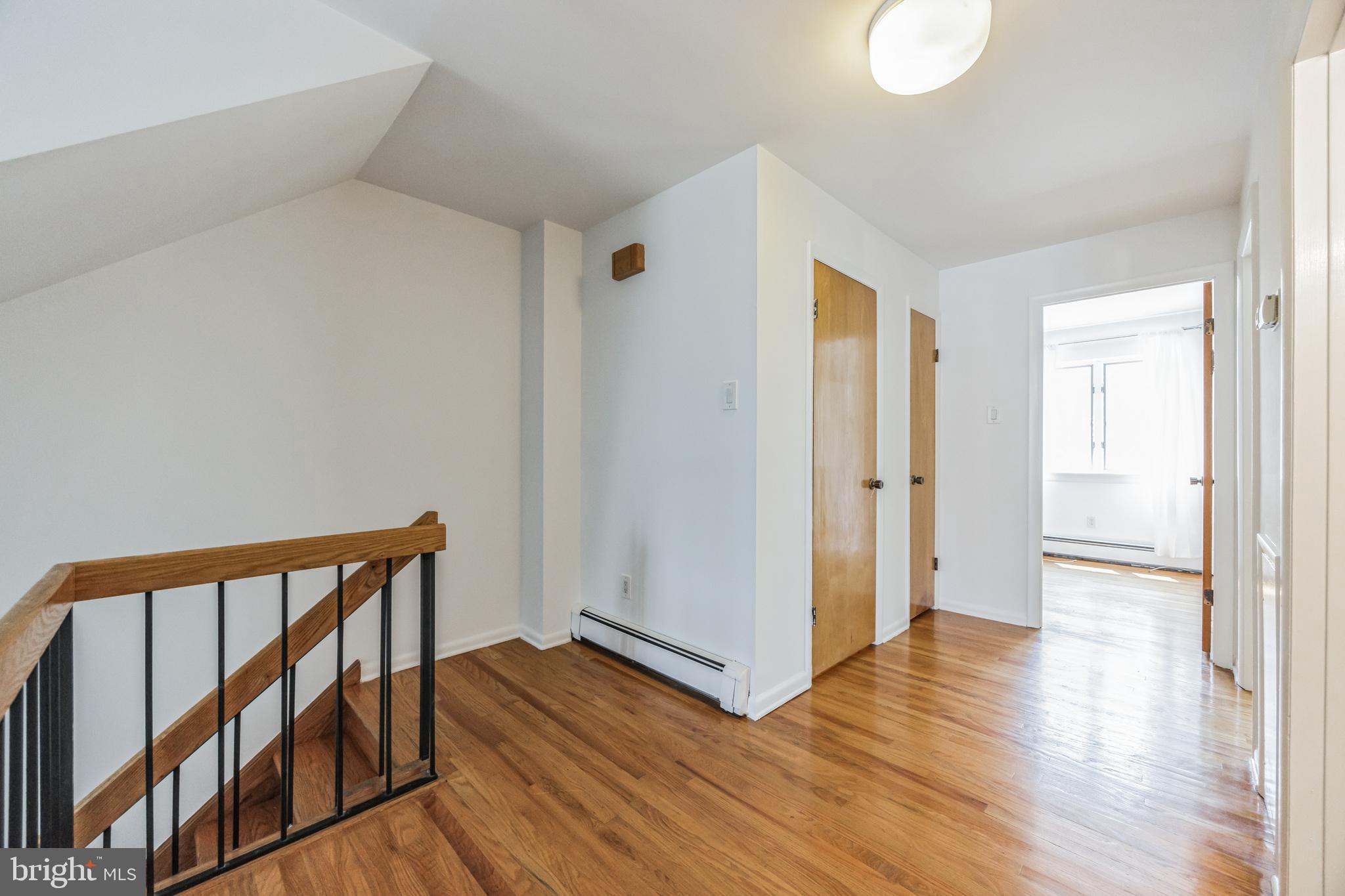 1928 Rodman Street, Unit A Philadelphia, PA 19146 - Photo 16 of 28 a view of hallway with wooden floor