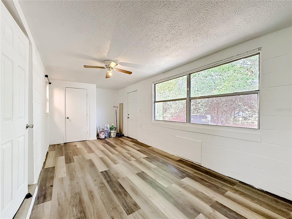 3 Bahia Pl Loop Ocala, FL 34472 - Photo 24 of 31 a view of a livingroom with a window and a ceiling fan