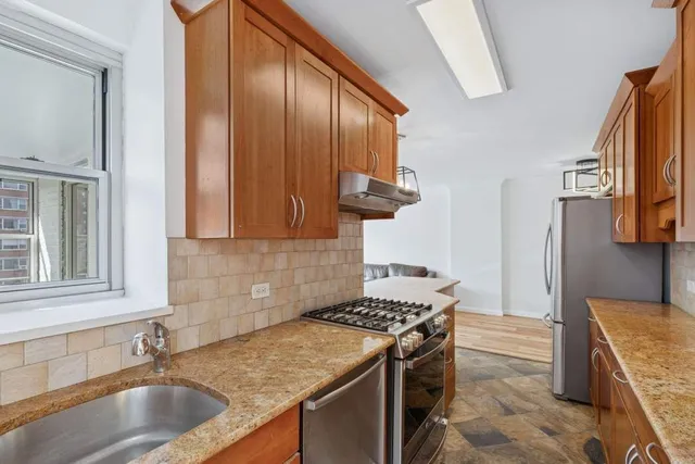 a kitchen that has a stove and a sink