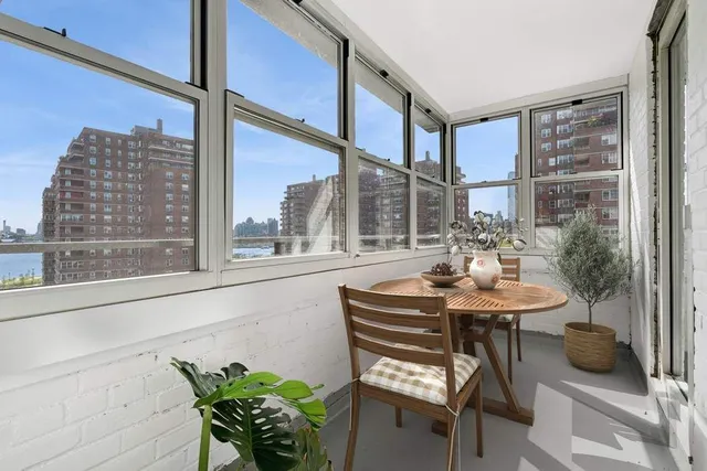 a kitchen with granite countertop stainless steel appliances a sink stove and refrigerator