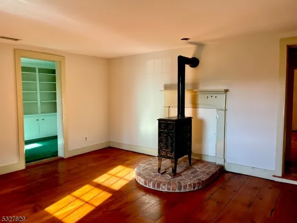 a living room with hard wood flooring