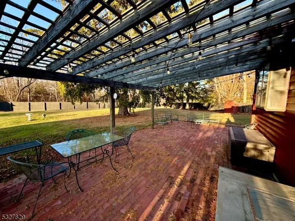 a view of a swimming pool with a yard
